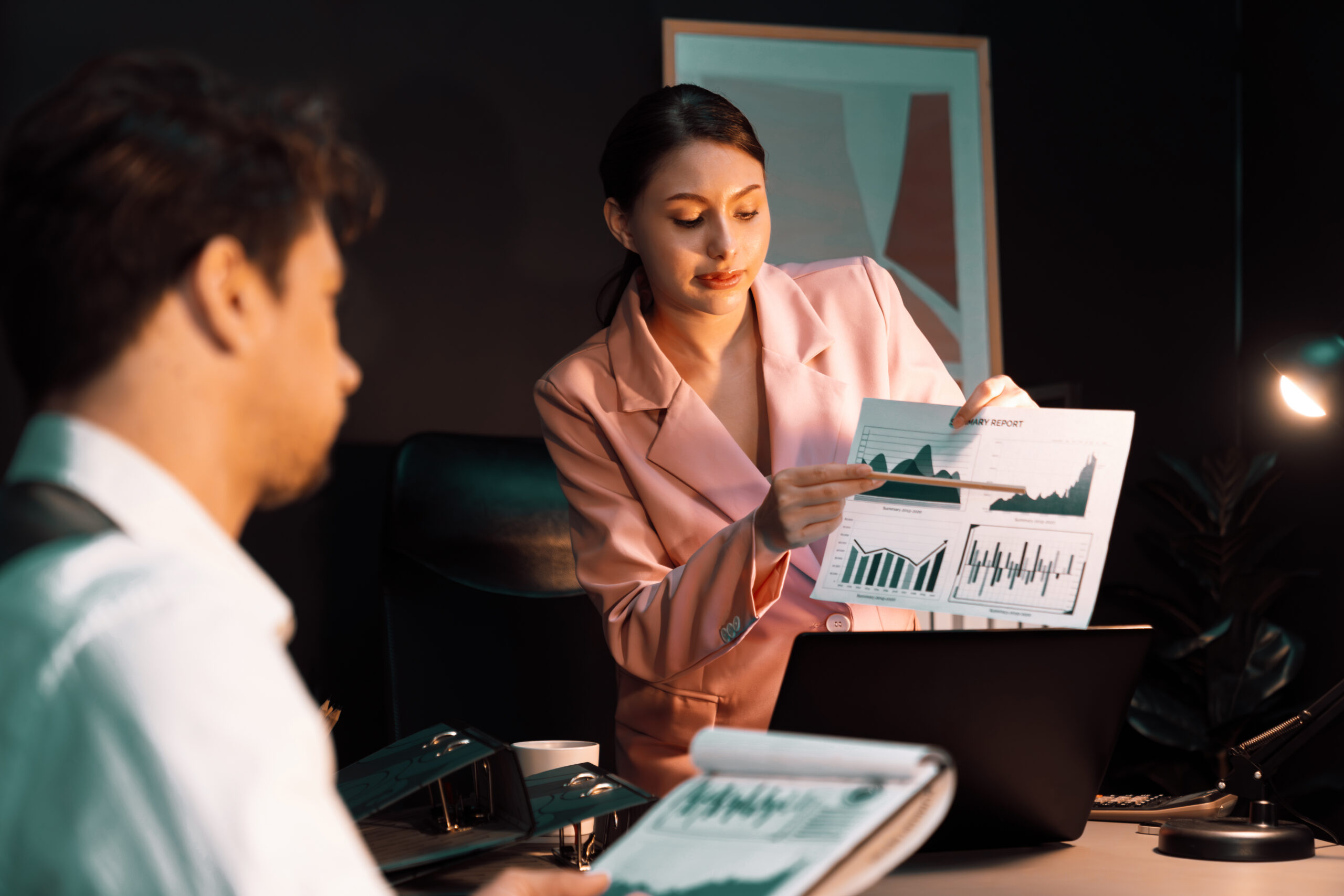 Focusing on woman presenting graph while man holding paper to sign. Postulate.